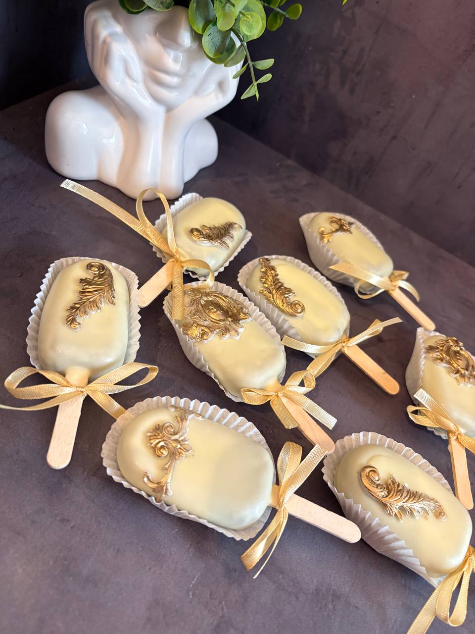 Mochi popsicles with gold leaf decoration