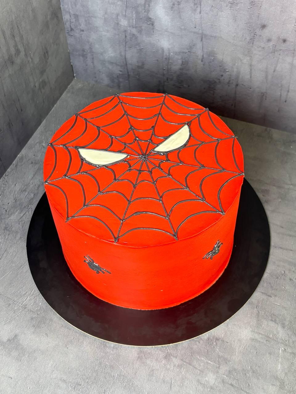 Spiderman red birthday cake with spiderweb