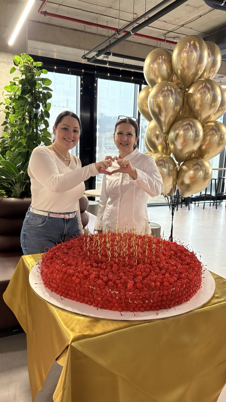Sweet House Praha team with large cherry corporate cake