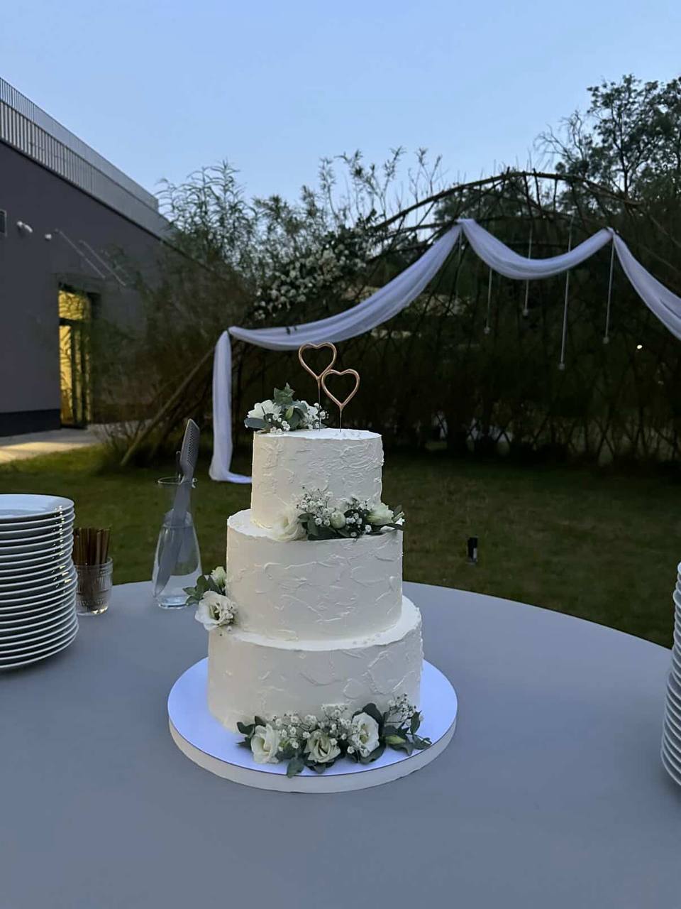 Two-tier wedding cake with heart topper