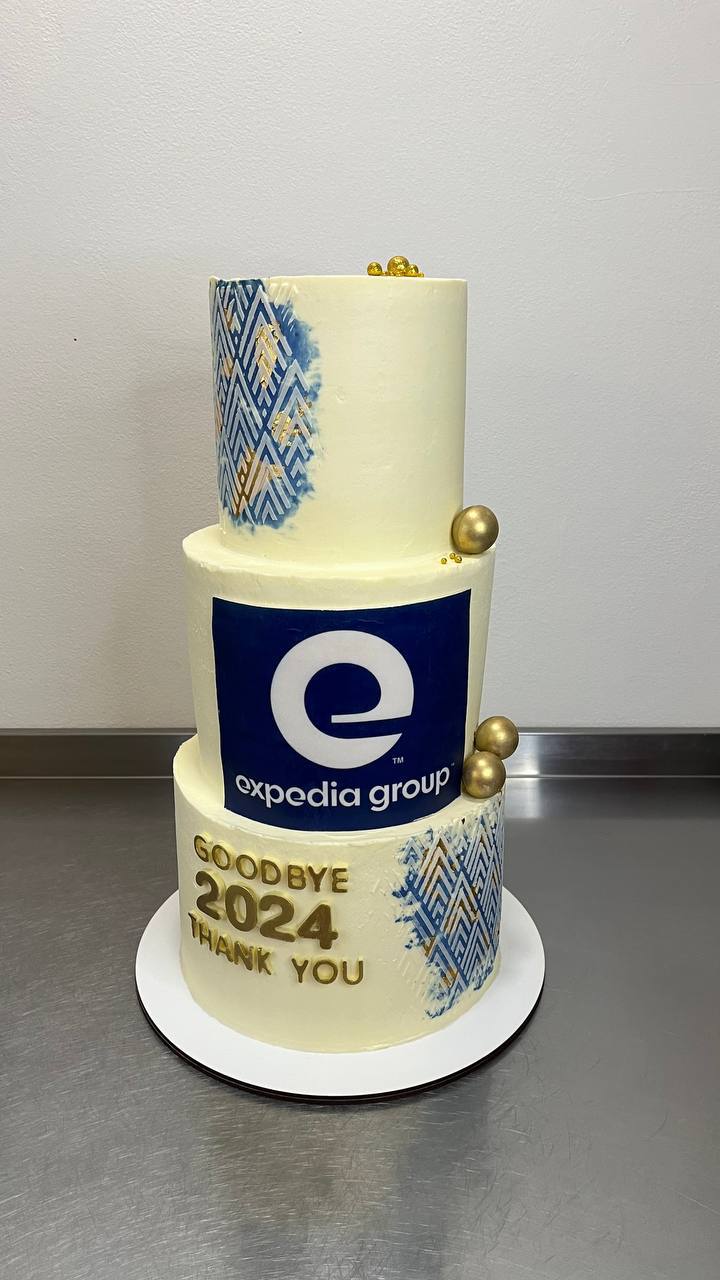 Expedia Group branded three-tier corporate cake with Goodbye 2024 message